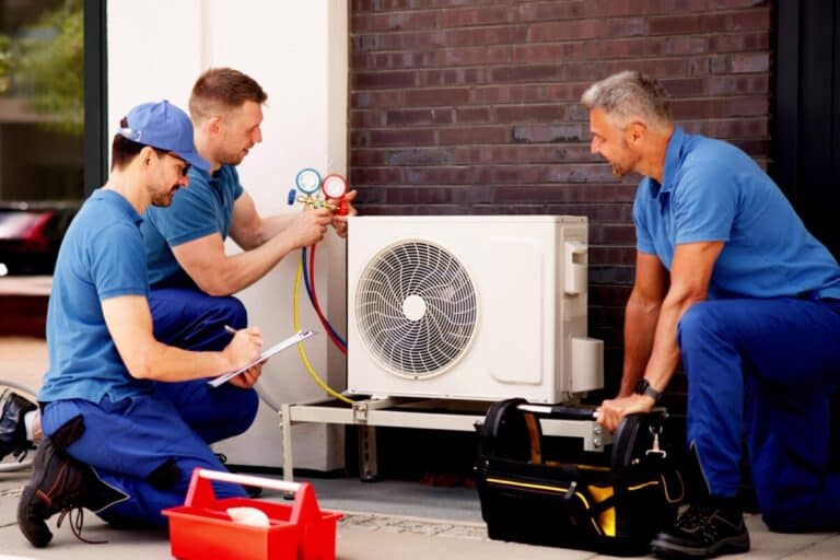 HVAC technician using ServiceBridge mobile app for field service scheduling and work orders